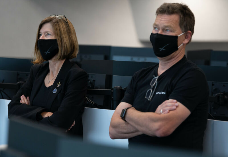 NASA's Kathy Lueders, left, and SpaceX's Hans Koenigsmann track the Demo-2 crew mission in 2020. SpaceX is helping to enable NASA to think less about transportation and more about exploration.