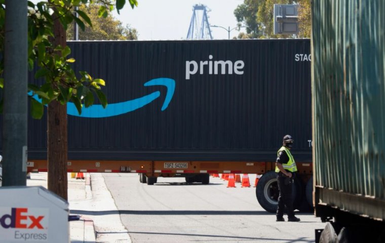 An Amazon Prime delivery truck drives through the Port of Los Angeles and Long Beach on April 22, 2020, in Long Beach, California. (Photo by Robyn Beck / AFP)