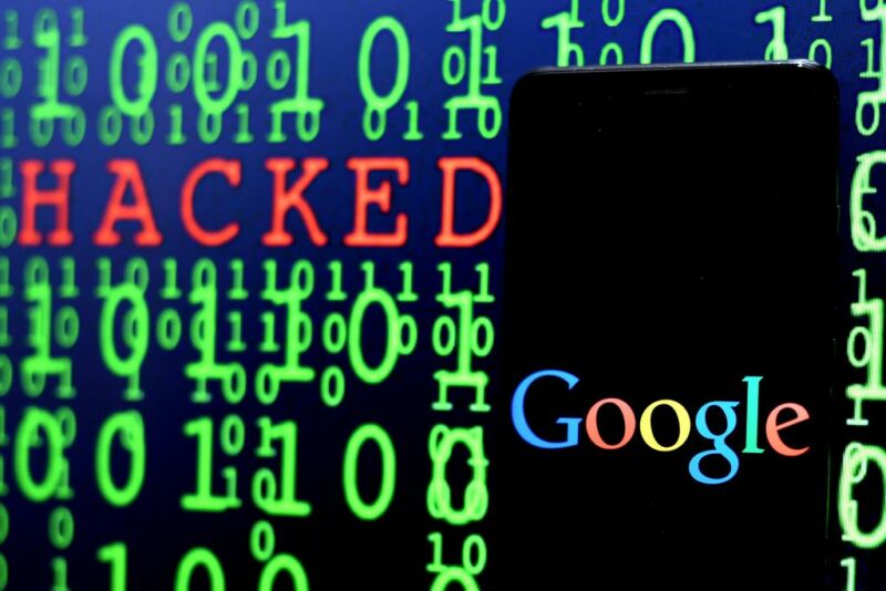 A computer screen filled with ones and zeros also contains a Google logo and the word hacked.