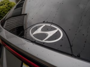 The rear Hyundai badge on a Tucson Hybrid