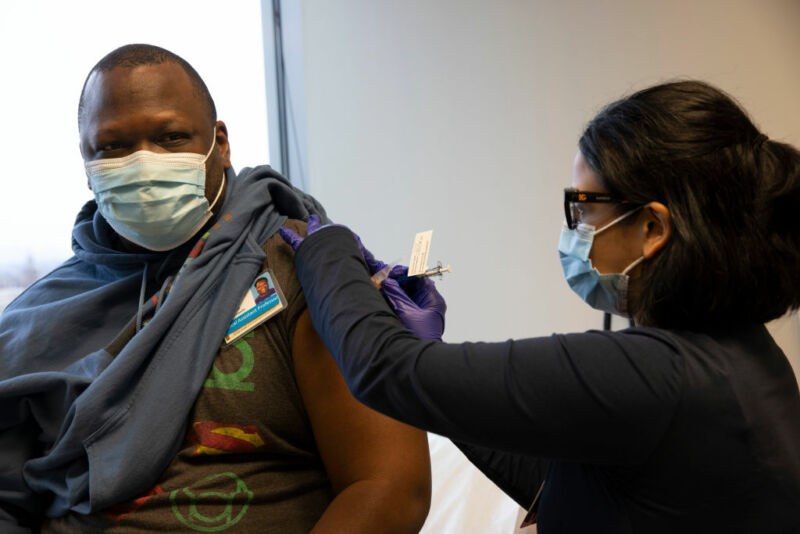 Image of a man receiving an injection.