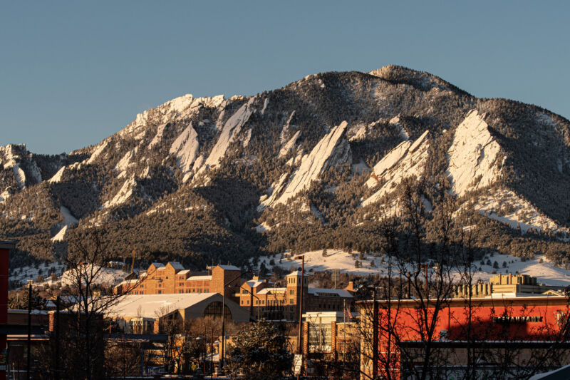 Morning sun against the foothills of Boulder, Colorado, business area and campus.