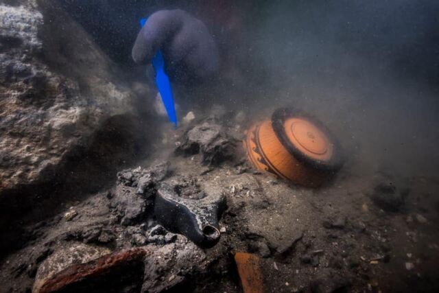 Divers examined the wreck after a sonar survey rediscovered it buried in mud and debris.