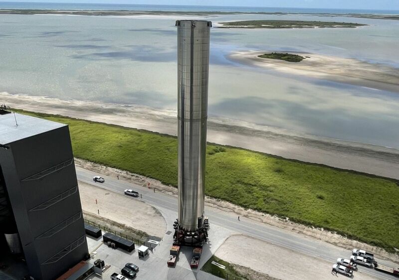 A shockingly large rocket prepares to launch next to the coast.