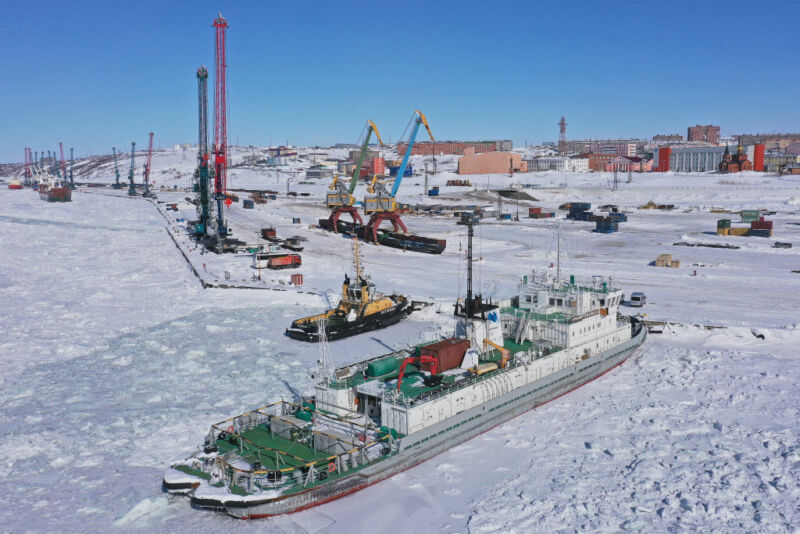 Image of a boat and dock surrounded by ice.