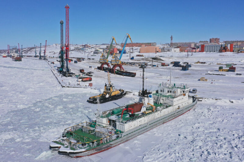 Image Of A Boat And Dock Surrounded By Ice.