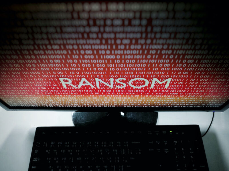 The Word Ransom Dominates A Menacing, Red Computer Monitor.