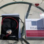 Unboxing the Titanium, we see a large bag, the Titanium headset itself, and a pair of included foam earplugs. The printed user manual is in the bag. The Air has the same included gear in a slightly fancier package.