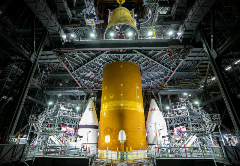 Space rocket construction in a mammoth hangar.