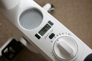 Desk Bike's resistance knob and small digital display showing miles biked