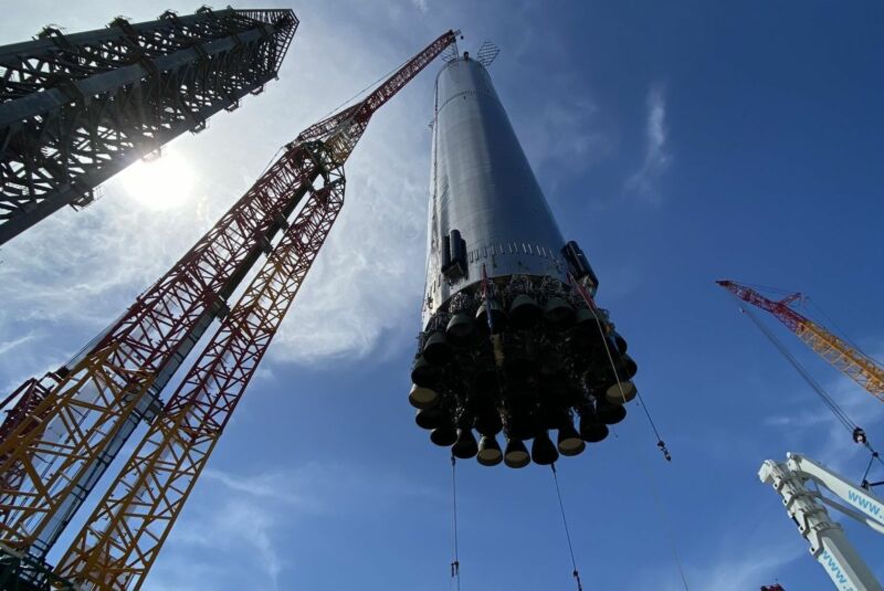 SpaceX's Booster 4 is lifted on to its orbital launch mount in South Texas.