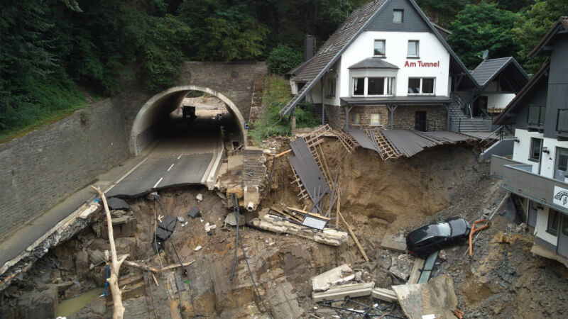 Image of a destroyed road and parking area.