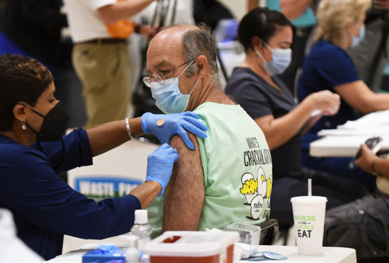 A nurse administers a COVID-19 vaccine at a vaccination site in Florida on August 18, 2021.