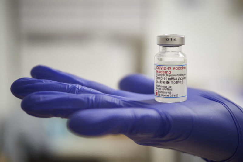  A health professional holds a vial of the Moderna vaccine against Covid-19 