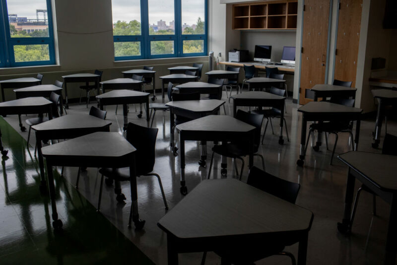 Image of a dark and empty classroom.