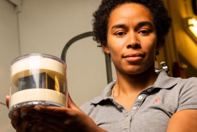 Brittany Robertson with the PNNL cube in a protective case.