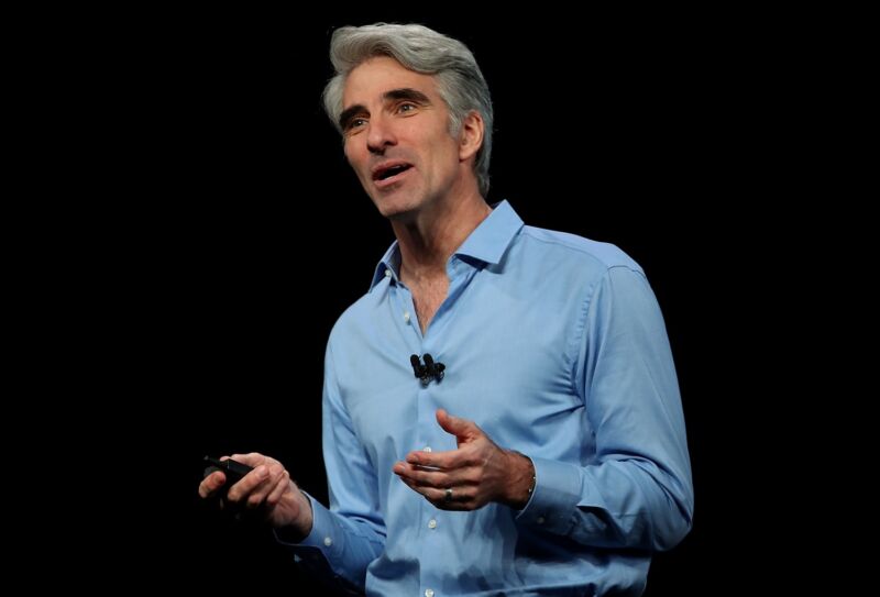 Apple executive Craig Federighi speaking on stage at an Apple conference in 2018.