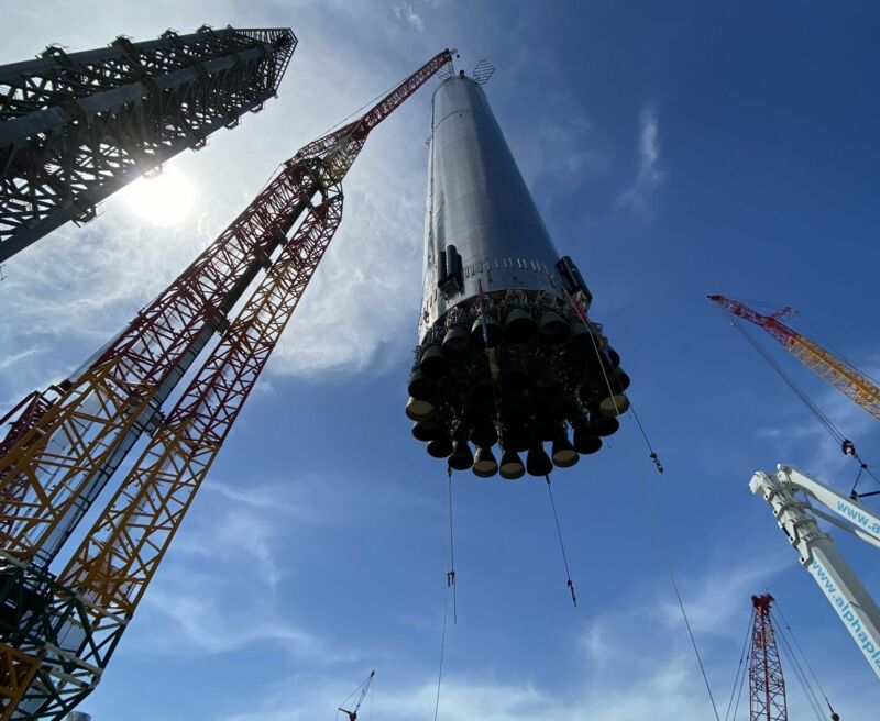 Photograph from beneath a giant rocket component.