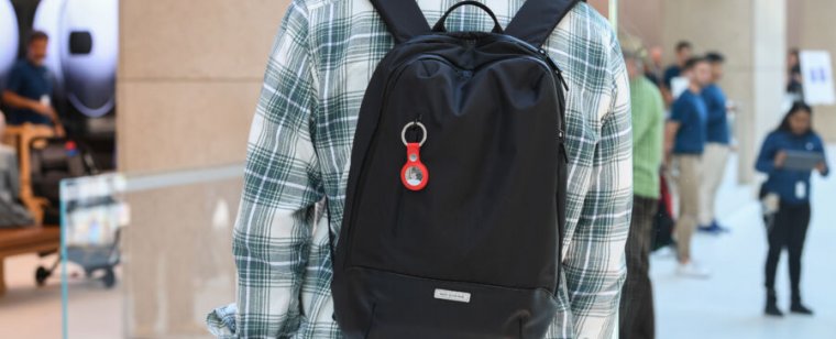 A plastic tag hangs from a youth's backpack.