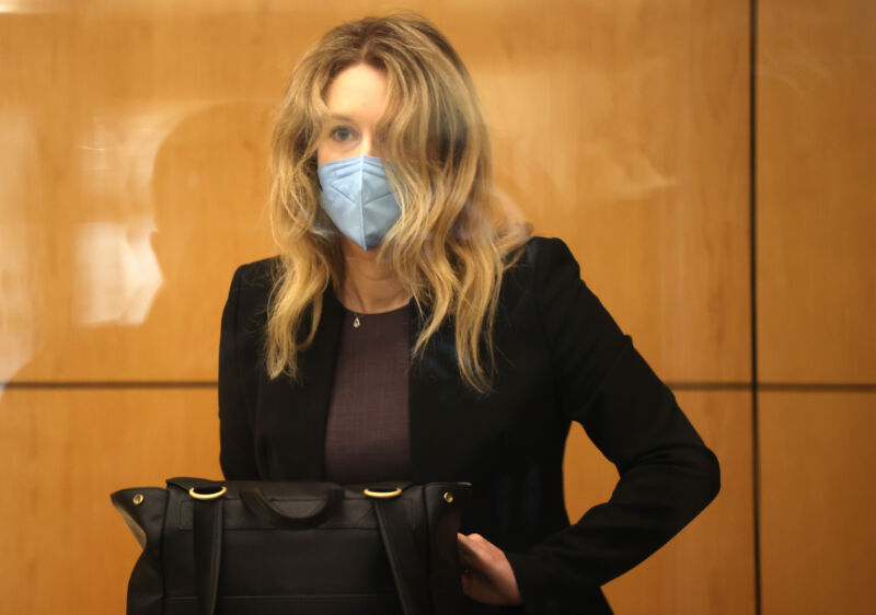 Former Theranos founder and CEO Elizabeth Holmes goes through security after arriving for court at the Robert F. Peckham Federal Building September 17, 2021 in San Jose, California. Holmes is facing charges of conspiracy and wire fraud for allegedly engaging in a multimillion-dollar scheme to defraud investors with the Theranos blood testing lab services.