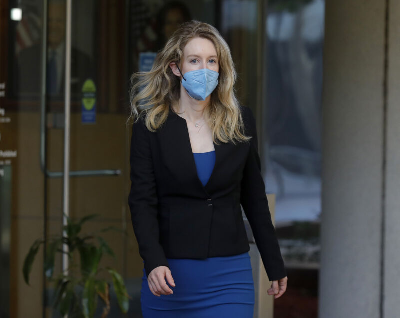 Theranos founder Elizabeth Holmes leaves the Robert F. Peckham Federal Building and the US Courthouse in San Jose, Calif. On Wednesday, September 22, 2021. Holmes is charged with two counts of conspiracy to commit fraud by wire and nine counts of wire fraud and faces up to 20 years in prison if convicted.