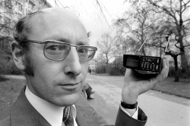 Sir Clive Sinclair holding the world's smallest television screen when it was created by Sinclair Radionics in 1977.