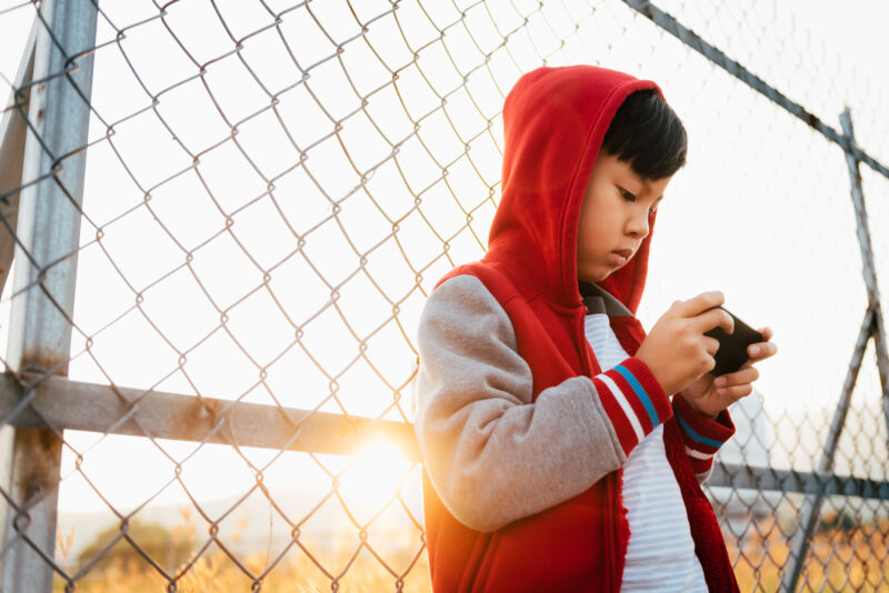 A child uses a smartphone.