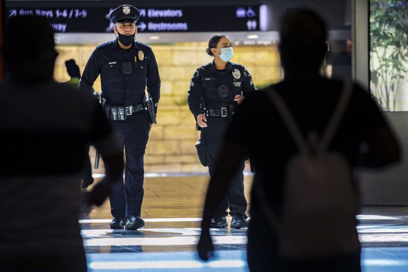 Two Los Angeles Police Department officers walking through Union Station.