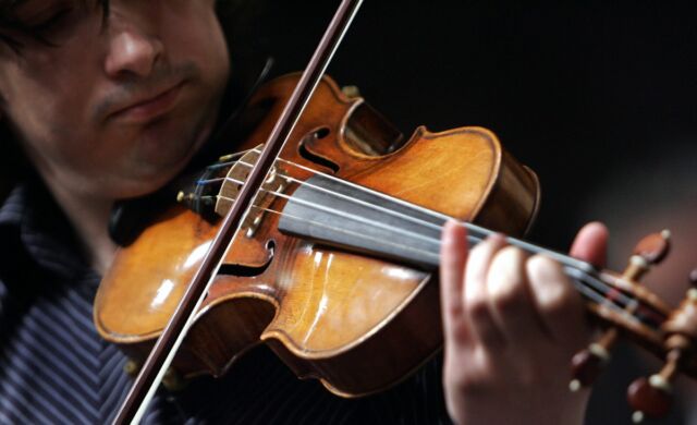 Violinist Adrian Pintea plays a 1729 Stradivari known as the "Solomon, Ex-Lambert" in 2007 at Christie's in New York.