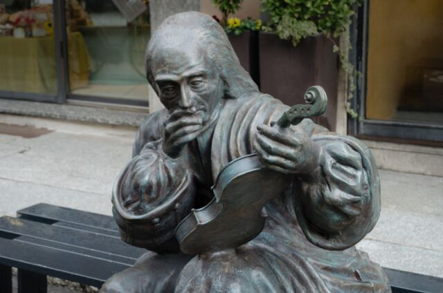 Close-up of the sculpture of Antonio Stradivari (1644–1737) in Corso Garibaldi, Cremona, Italy.