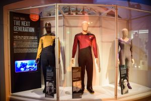 Original uniforms for (l-r) Geordi LaForge, Captain Jean-Luc Picrd, and Deana Troi from Star Trek: The Next Generation