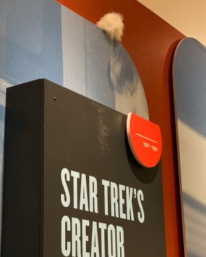 Tribble hidden above an exhibit sign
