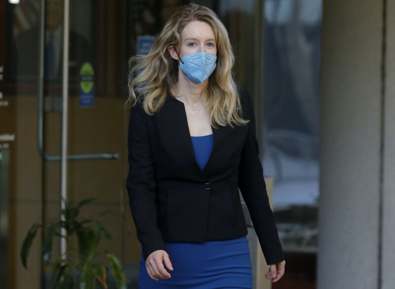 Theranos founder Elizabeth Holmes leaves the Robert F. Peckham Federal Building and US Courthouse in San Jose, Calif., on Wednesday, Sept. 22, 2021. Holmes is charged with two counts of conspiracy to commit wire fraud and nine counts of wire fraud and could face up to 20 years in prison if convicted.