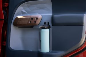 The door card of a Ford Maverick showing how it holds a large water bottle.