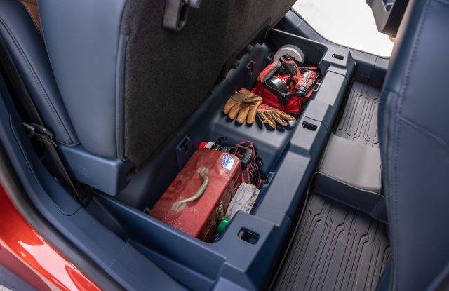 The underseat storage area of a Ford Maverick
