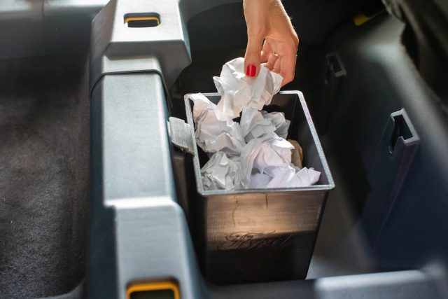 A 3D-printed bin installed in the underseat storage area of a Ford Maverick