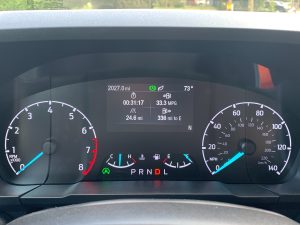 A Ford Maverick dashboard showing 33.3 mpg over 25 miles