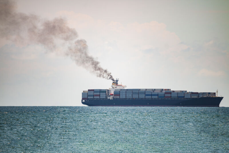 A container ship sails off the coast of Thailand.