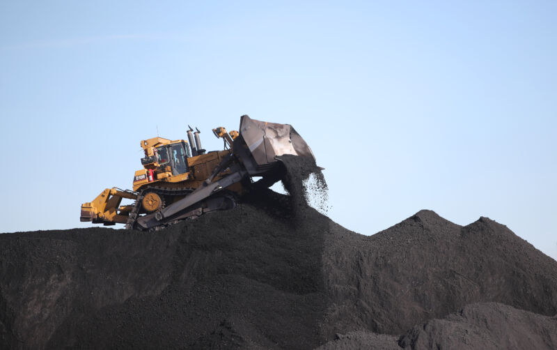 Heavy equipment moves coal into piles at PacifiCorp's Hunter coal-fired power plant outside of Castle Dale, Utah.