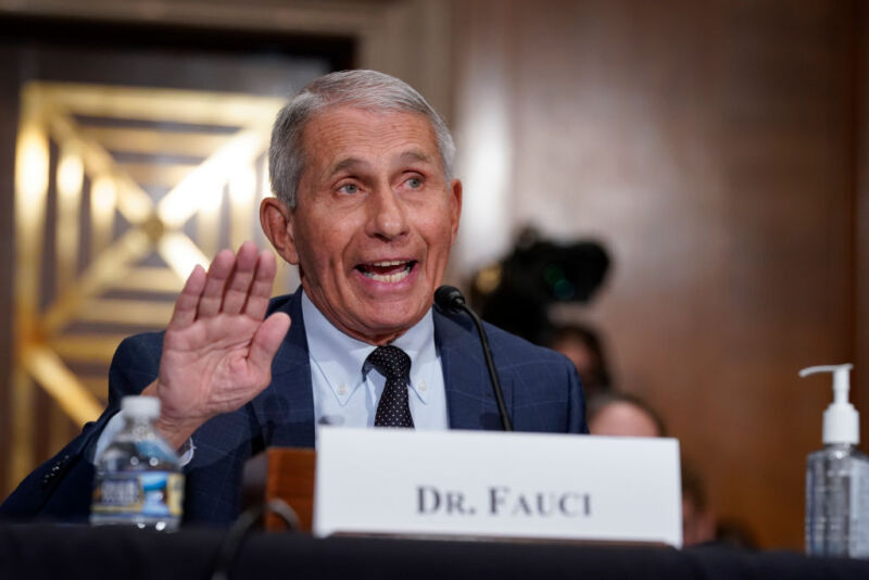 Image of a person gesturing as he speaks.