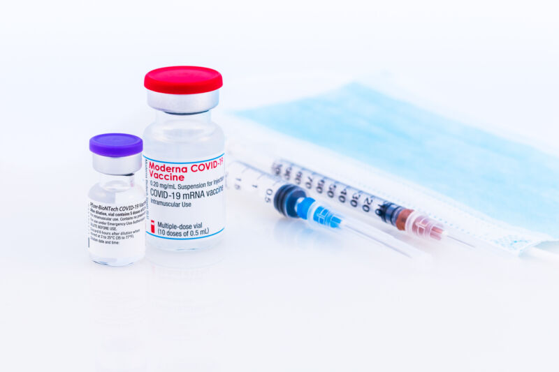 Image Of Vaccine Vials And Syringes.