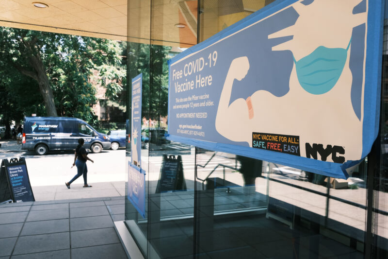 A city-operated mobile pharmacy advertises the COVID-19 vaccine in a Brooklyn neighborhood on July 30, 2021, in New York City. 