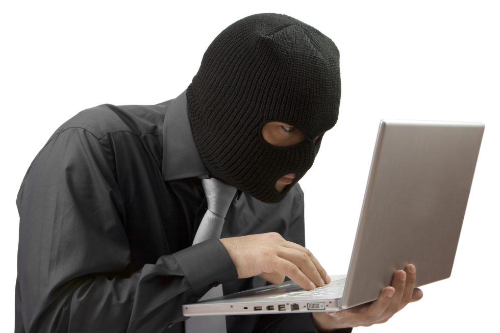 Did You Really Think We Were Going To Be Able To Get Through A Cybersecurity Article Without At Least One Guy-In-A-Ski-Mask-With-A-Laptop Stock Photo?