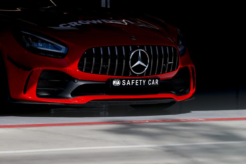 Mayländer and his co-driver sit on alert, waiting to be called into action by race control.