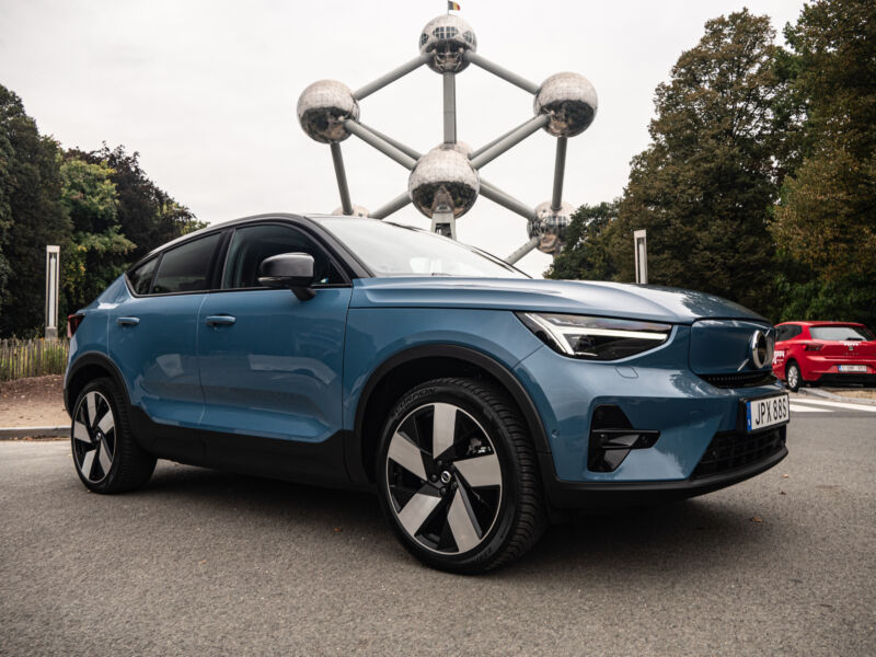 A Volvo C40 Recharge Parked In Front Of Brussels' Atomium.