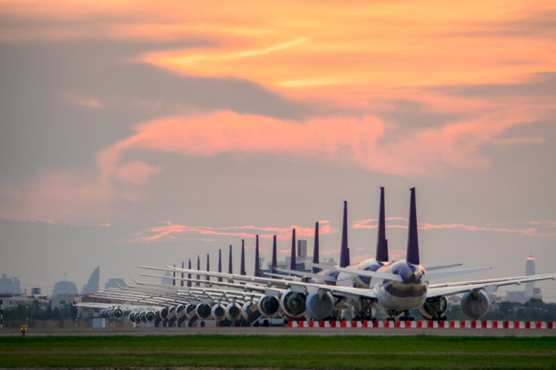 So many airplanes are in line on the runway waiting for take off. These Air Force planes are part of Operation stop service to transport in Covid-19 situation.