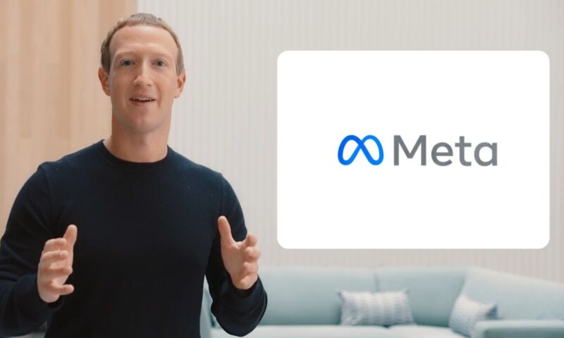 Mark Zuckerberg speaks in front of a monitor that says Meta.
