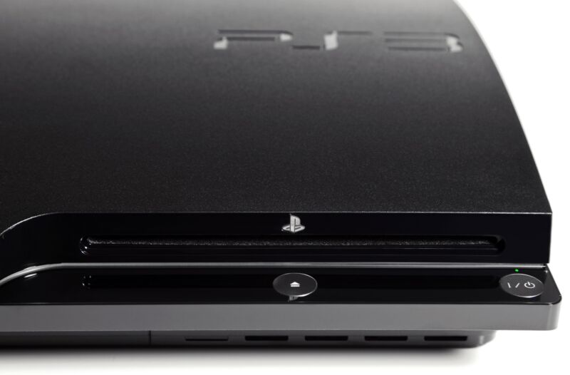 Closeup of the disc drive on a PlayStation 3 video game console.