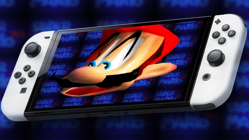 Videogame character Mario's face on a handheld gaming system.