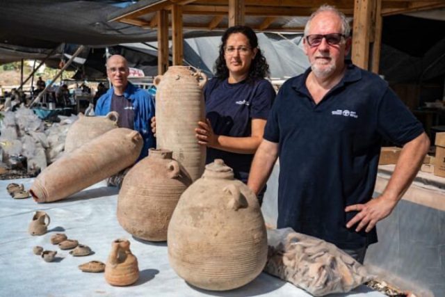 Excavation directors pose with clay jars and other fragments recovered from the Yavne dig. (l-r): Dr. Elie Hadad, Liat Nadav-Ziv, and Dr. Jon Seligman.